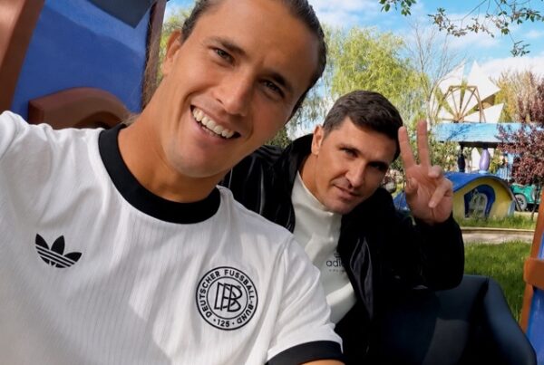 Alexander Zverev and Mischa Zverev sitting in the back of a car during the filming of adidas' Ride Home With series, laughing together while driving through Madrid.